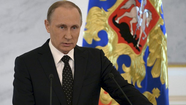 Russian President Vladimir Putin addresses the Federal Assembly, including State Duma deputies, members of the Federation Council, regional governors and civil society representatives, at the Kremlin in Moscow Dec. 3, 2015. 