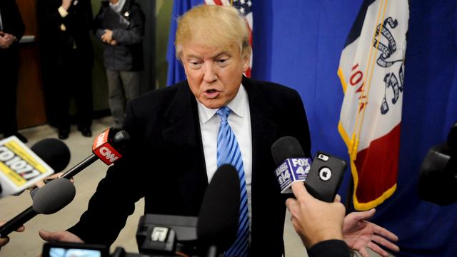 Republican presidential candidate Donald Trump answers questions from the media ahead of a campaign stop in Spencer, Iowa, Dec. 5, 2015. 