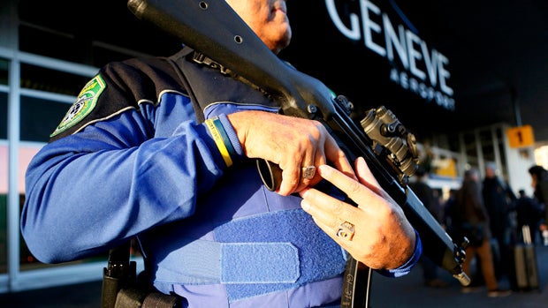 A County of Geneva police officer stands guard outside Cointrin airport in Geneva, Switzerland, Dec. 10, 2015. 