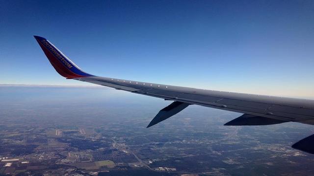 ​A photo taken by Lorenzo Hernandez Jr. shows a "flap track canoe fairing," part of an aircraft wing designed to reduce drag, at what Southwest Airlines said was an "irregular angle" 