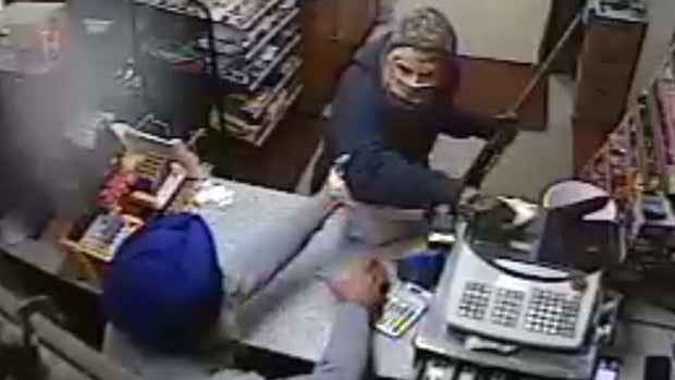 ​A mini mart clerk takes on a masked gunman during an attempted robbery in Staatsburg, N.Y., Dec. 15, 2015. 