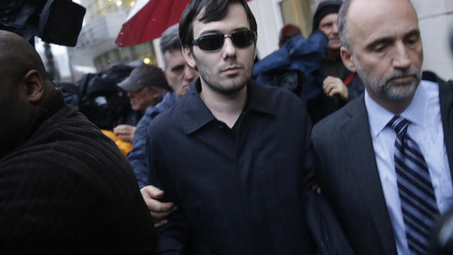 Martin Shkreli, center, leaves the courthouse after his arraignment in New York Dec. 17, 2015. 