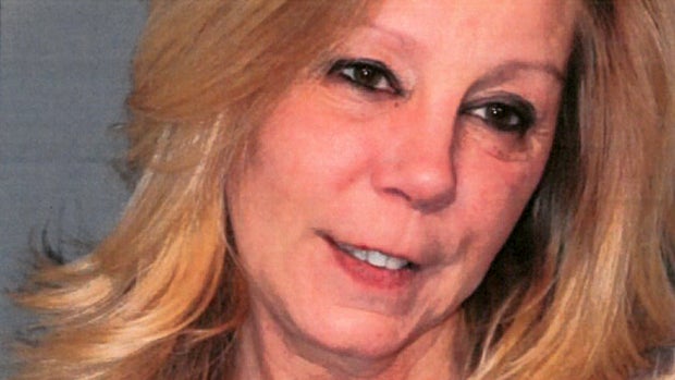 ​Susan Conway-Lally, 52, is seen in a booking photo provided by the Salem Police Department in Massachusetts. 