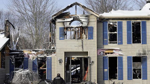 Investigators search a deadly house explosion Jan. 12, 2016, in Northfield Center Township, Ohio. 