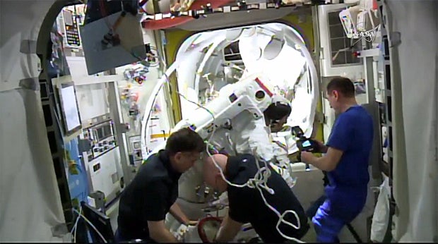 Spacewalk cut short by water leak in astronaut's helmet CBS News