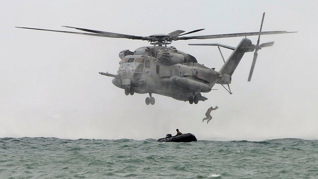 A CH-53E Super Stallion heavy lift assault helicopter hovers above the sea before it drops U.S. and Philippine marines during training as part of the annual joint Philippine-U.S. military exercises at the Philippine marine base in Ternate, Philippines, Se 
