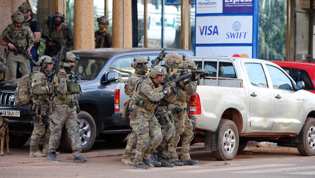 French special forces take position near the Splendid Hotel following an attack by al Qaeda-linked gunmen in Ouagadougou, Burkina Faso, Jan. 16, 2016. 