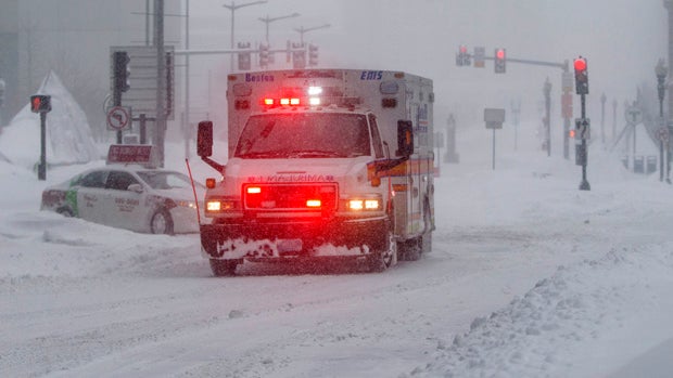 An ambulance drives past South Station during a winter storm that dropped over a foot of snow Feb. 15, 2015, in Boston, Massachusetts. 