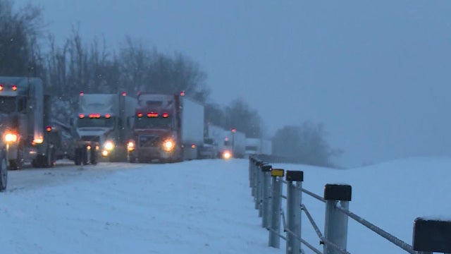 ​Trucks are stuck on Interstate 75 south of Lexington, Kentucky, Jan. 22, 2016. 