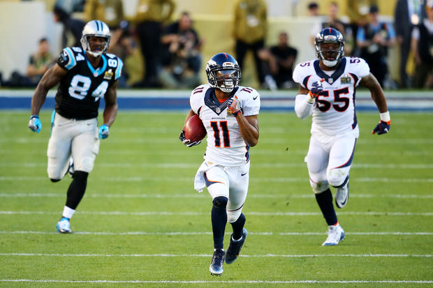 Jordan Norwood #11 of the Denver Broncos returns a punt against the Carolina Panthers. 
