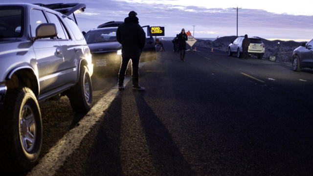 Media wait at a checkpoint about 4 miles from the Malheur Wildlife Refuge Headquarters near Burns, Oregon, on Feb. 11, 2016. 