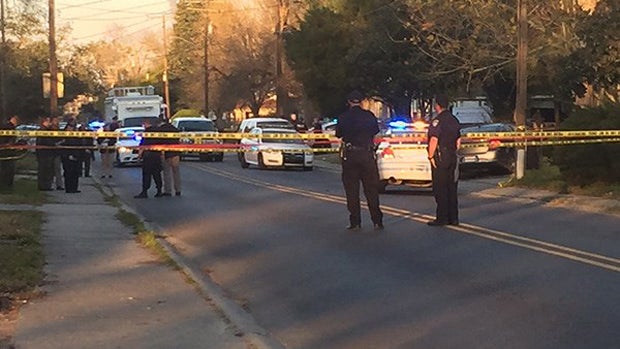 ​Crews work the scene in Baton Rouge, Louisiana, after two police officers were shot Feb. 13, 2016. 