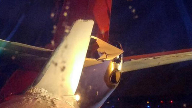 An American Airlines plane wing hit the tail of a Southwest Airlines plane at Detroit Metropolitan Airport in Romulus, Michigan, Feb. 17, 2016, in this photo provided by Carlos Salinas. 
