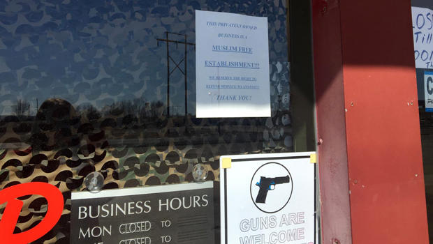 A sign on the front door of the Save Yourself Survival and Tactical Gun Range in Oktaha, Oklahoma, says the range is a "Muslim-free" establishment. 