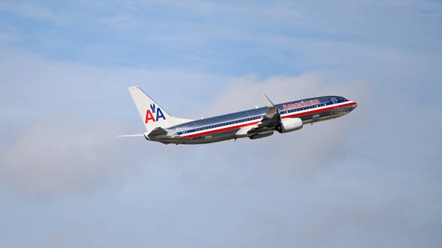 An American Airlines plane takes off from Miami International Airport on Nov. 12, 2013, in Miami, Florida. 