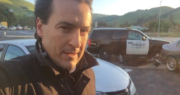 Car nearly crashes into California TV reporter while on air - CBS News