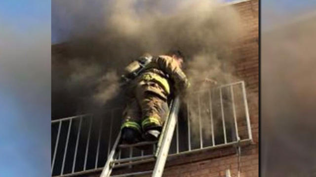 Firefighter ​Danny Lovato removed his mask to help great-grandmother Phyllis Terrell inside a burning building in Washington, D.C., on March 10, 2016. 