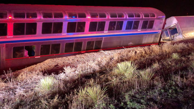 Two of five Amtrak train cars that derailed west of Dodge City, Kansas ealry on March 14, 2016 are seen in photo provided to CBS News by a passenger 