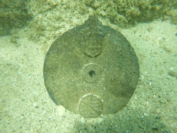 A disc found amid the 500-year-old wreckage of a Portuguese explorer's ship off the coast of Oman, believed to be part of a navigational device known as an astrolabe 