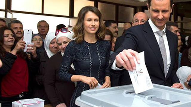 ​Syrian President Bashar Assad is seen casting his ballot in parliamentary elections 