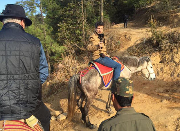 bhutan-schmidt-filming-petersen-horseback-trek-up-to-tigers-nest.jpg 