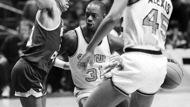 Dwayne "Pearl" Washington (31) of Syracuse University drives around Dana Barros (21) of Boston College during the Big East tournament at New York's Madison Square Garden March 6, 1986. 