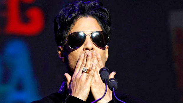 Singer Prince gestures as he announces upcoming live dates at the Apollo Theater in New York Oct. 14, 2010. 