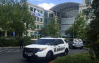 A Santa Clara County sheriff's department vehicle is shown parked outside one of the main office buildings of the Apple campus in Cupertino, California, April 27, 2016. 