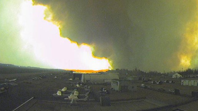 The flames of the Fort McMurray wildfire are seen approaching Edmonton Airport in Alberta, Canada 