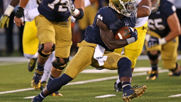 Greg Bryant, No. 1 of the Notre Dame Fighting Irish, runs against the Michigan Wolverines at Notre Dame Stadium on Sept. 6, 2014 in South Bend, Indiana. 