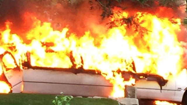 A limousine on the way to a high school prom burst into flames in Natick, Massachusetts, on May 13, 2016, in this image that Billy Cotter provided to CBS Boston. 