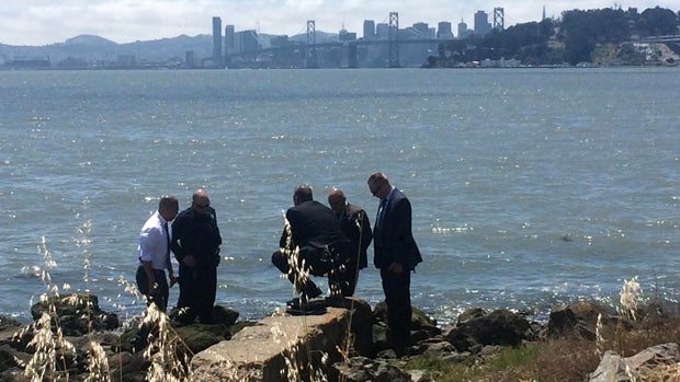 Crews work the scene after a torso was discovered near the Bay Bridge in Oakland, California, on May 25, 2016. 