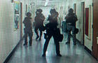 ​Police officers search corridors and rooms after a report of an active shooter on the UCLA campus in Los Angeles, California, June 1, 2016, in a still image from a CCTV camera. 
