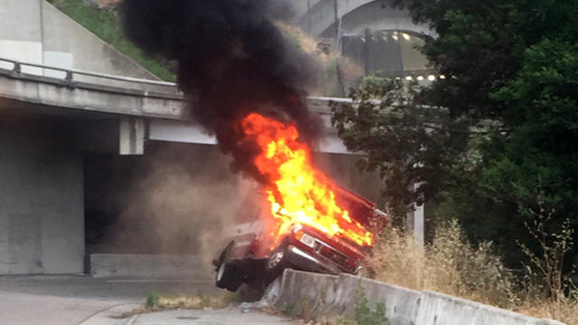 ​A stolen ambulance caught fire after a police chase on the San Francisco-Oakland Bay Bridge ended at the off-ramp to Treasure Island June 7, 2016. 