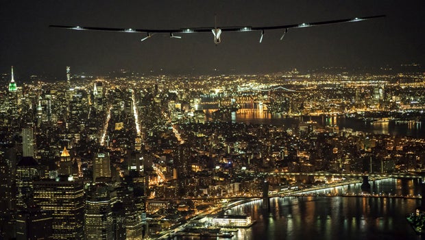 ​Solar Impulse 2, the solar airplane piloted by Swiss adventurer Andre Borschberg, flies over Manhattan on June 11, 2016, shortly before landing at John F. Kennedy airport. 