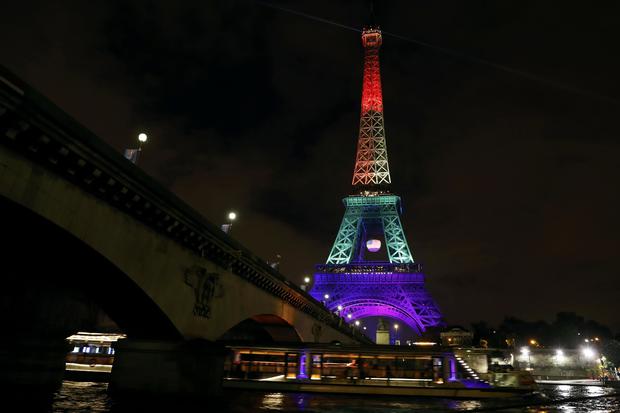 The Eiffel Tower is illuminated in memory of the victims of the gay nightclub mass shooting in Orlando, Florida, in Paris, June 13, 2016. 