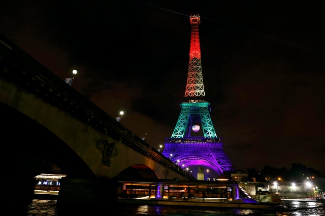 The Eiffel Tower is illuminated in memory of the victims of the gay nightclub mass shooting in Orlando, Florida, in Paris, June 13, 2016. 