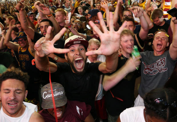 Cleveland Cavaliers fans celebrate at watch party outside Quicken Loans Arena in Cleveland after Cavs beat Golden State Warriors in NBA Championship Game played in Oakland, California on June 19, 2016 
