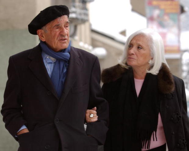 ​Nobel Peace Prize laureate Elie Wiesel and his wife Marion walk in Davos, Switzerland, after attending a Holocaust commemoration ceremony organized by the World Economic Forum at the Davos city hall on Jan. 26, 2005. 