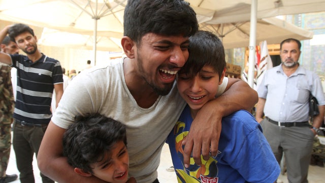 ​Mourners react during funeral of victim of July 3, 2016 suicide car bombing in Karada shopping area of  Baghdad 
