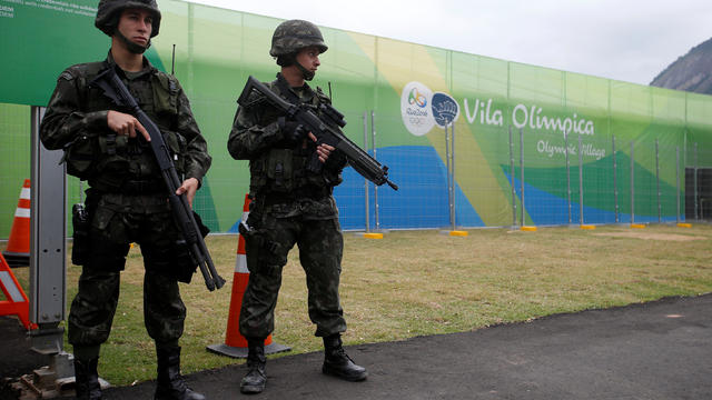 ​Soldiers of the Brazilian Armed Forces stand guard outside the Olympic Village in Rio de Janeiro, Brazil, on July 21, 2016. 