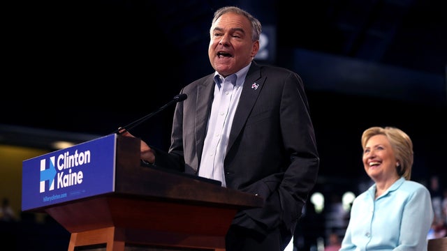 Democratic vice presidential candidate Sen. Tim Kaine, D-Virginia, speaks alongside Democratic presidential candidate former Secretary of State Hillary Clinton during a campaign rally at Florida International University Panther Arena on July 23, 2016, in  