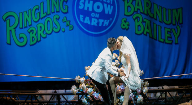 High wire walkers Mustafa Danguir and Anna Lebedeva of Ringling Bros. and Barnum & Bailey exchange wedding vows 30 feet above the NRG Stadium floor on a high wire that is no wider than a human thumb at NRG Park on July 26, 2016, in Houston, Texas. 