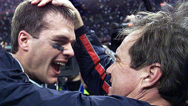 Tom Brady hugs Bill Belichick - New England Patriots' quarterback Tom Brady celebr 
