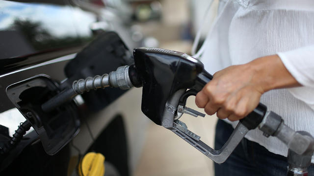 Angela Prada fills her vehicle with gas at a U-Gas station on Oct. 19, 2015, in Miami, Florida. 