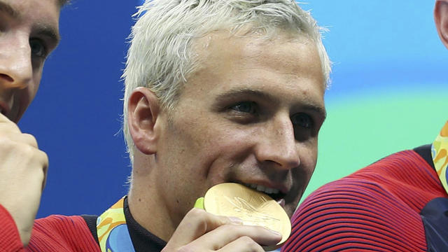 Ryan Lochte and his teammates appear with their gold medals after the men’s 4x200m freestyle relay final in the Rio 2016 Summer Olympic Games at Olympic Aquatics Stadium Aug 9, 2016, in Rio de Janeiro, Brazil. 