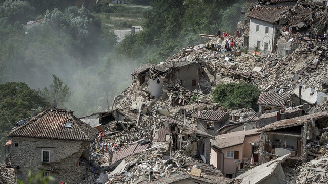 Rescuers work following an earthquake in Pescara del Tronto, Italy, Aug. 24, 2016. 
