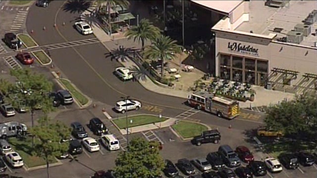 Crews work the scene after shoppers mistook the sounds of popping balloons for gunshots at Florida Mall in Orlando on Aug. 25, 2016. 