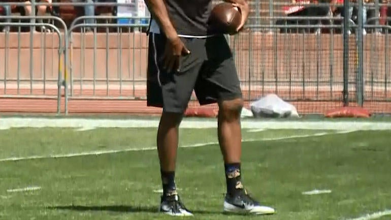 San Francisco 49ers quarterback Colin Kaepernick apparently wears socks portraying police as pigs during a practice in August. 