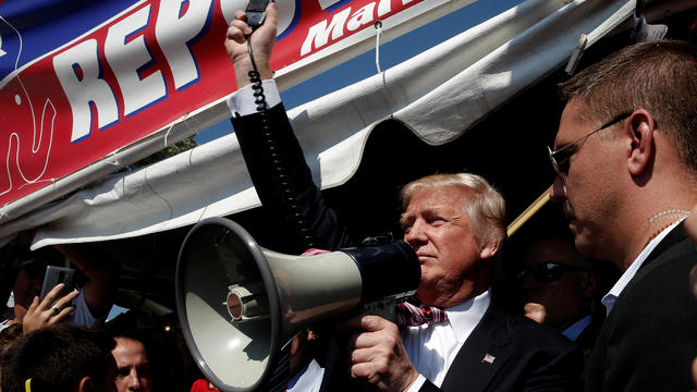 Republican presidential nominee Donald Trump uses a bullhorn to speak to supporters during a campaign stop at the Canfield County Fair in Canfield, Ohio, Sept. 5, 2016. 